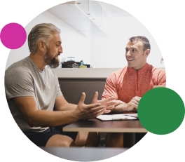 Men at a table getting to know each other